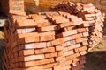 red brick laid out on a pallet, a lot of bricks on the construction site Royalty Free Stock Photo