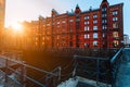 A red brick multi-storey houses of Speicherstadt Hamburg. Famous landmark of old red brick buildings in golden sunset