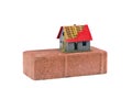 Red brick and small house model building concept isolated Royalty Free Stock Photo