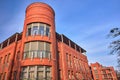 A red brick tenement house with a round tower Royalty Free Stock Photo