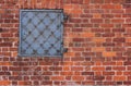 Red brick texture. Old brick wall background. Forged metal hatch installed into a brick wall Royalty Free Stock Photo