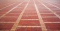 Red brick tile floor neatly arranged on a patterned texture background. Royalty Free Stock Photo