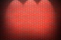 Red brick wall background with beams of light