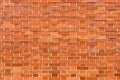 Red brick wall background. Horizontal shot of brickwork pattern as textured graphic design element