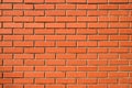 Red brick wall. Background of a new brick house. Perfect smooth brickwork Royalty Free Stock Photo