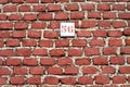 Red brick wall background with number 56 Royalty Free Stock Photo