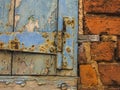 Red brick wall with blue wood window, detail. Royalty Free Stock Photo