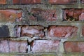 Red brick wall with broken bricks Royalty Free Stock Photo