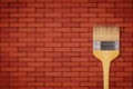 Red brick wall and brush Royalty Free Stock Photo