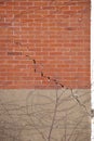 Red Brick Wall and Foundation with Large Crack and crumbling mortar Royalty Free Stock Photo