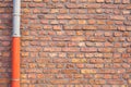 Red brick wall with gutter pipe Royalty Free Stock Photo