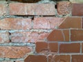 red brick wall and half ruined brown tiles Royalty Free Stock Photo