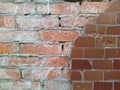 red brick wall and half ruined brown tiles Royalty Free Stock Photo