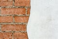 Red brick wall and half-ruined white stucco, architecture abstract background Royalty Free Stock Photo