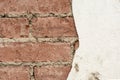 Red brick wall and half-ruined white stucco, architecture abstract background Royalty Free Stock Photo