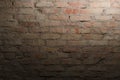 Red brick wall and light of lantern on it, dark night and lights on the building Royalty Free Stock Photo