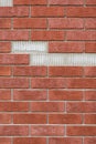 Red Brick wall with missing parts.