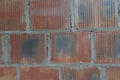 Red brick wall from an old dilapidated house
