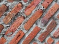 close up Red Brick Wall with with cement and sand Royalty Free Stock Photo
