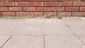 Red brick wall scene on concrete floor Royalty Free Stock Photo