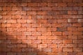 Red brick wall with shining light for background. Royalty Free Stock Photo