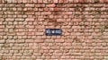 A red brick wall sign stick no bills