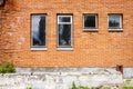 Red brick wall with some windows Royalty Free Stock Photo