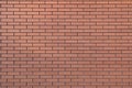 Red brick wall texture grunge background for home and interior design. Wide panoramic view of the building with good detail. Abstr Royalty Free Stock Photo