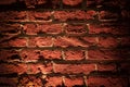 Red brick wall texture grunge background with vignetted corners. Grunge weathered stone texture Royalty Free Stock Photo