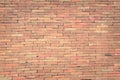 Red brick wall texture grunge background with vignetted corners, may use to interior design. Royalty Free Stock Photo