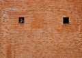 Red brick wall texture Retro weathered with pointed hole fan for interior decoration. Royalty Free Stock Photo