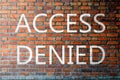 Red Brick wall texture with a word Access Denied Royalty Free Stock Photo