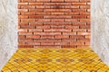 Red brick wall texture and yellow mosaic