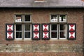 Red brick wall with two windows Royalty Free Stock Photo