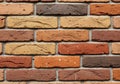 Red brick wall with various shades of brown, tan, and red bricks. Each rectangular Royalty Free Stock Photo