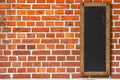 Red brick wall vintage vertical blackboard sign