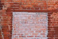 Red brick wall with white painted splotches Royalty Free Stock Photo