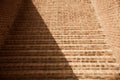 Red bricks made staircase with shadows