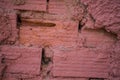 Red Bricks on Rough Wall. Not Properly Sealed with Mortar Creating Irregular Gaps in Between. Messy Adobe Installatio Royalty Free Stock Photo