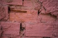Red Bricks on Rough Wall. Not Properly Sealed with Mortar Creating Irregular Gaps in Between. Messy Adobe Installatio