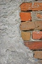 Red bricks stone wall background closeup, cracked ruined stucco, vertical plastered grunge grey beige stonewall limestone pattern Royalty Free Stock Photo