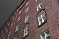 Red bricks white windows house Helsinki on grey Royalty Free Stock Photo