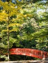 Red bridge across the Togawa river in Shimosuwa - Nagano prefecture, Japan Royalty Free Stock Photo