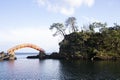 Red bridge conecting volcanic rock formations in Sado Island in Yajima and Kyojima.