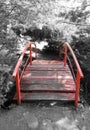 Red bridge in a Japanese garden Royalty Free Stock Photo