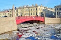 Red bridge over the Fontanka river and its reflection among the Royalty Free Stock Photo
