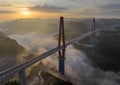 The red bridge under the backlight and the early morning clouds under the bridge