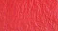 Red bright crumpled textured paper background