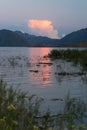 Red bright sunset in the mountain lake Royalty Free Stock Photo