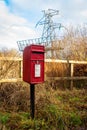 Red British Lamp Post Box in a rural setting in Scotland Royalty Free Stock Photo